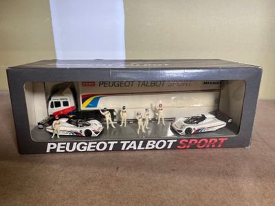a box with a toy car and a toy truck in it
