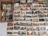 a lot of old postcards on the table