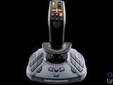 the joystick is sitting on a black surface with a black background