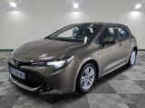 a grey toyota corolla parked on a checkered floor
