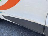 a close up of a white car with a star painted on the side