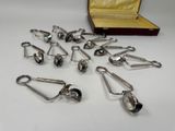 a lot of silver spoons in a case on a table