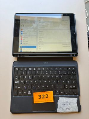 a laptop and a tablet on a table with a price tag on it