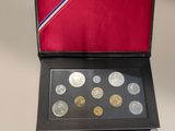 an image of a box of coins on a table with a red background