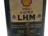 a can of shell oil sitting on a table