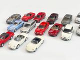 a lot of toy cars that are on the table