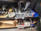 a lot of clutter on the shelves in the room