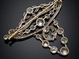 a gold and diamond broochle