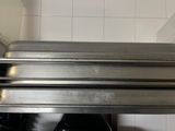 three pans stacked on top of each other in a kitchen