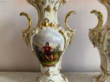 two vases that have pictures on them on them