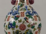 a vase that is sitting on a table in the room