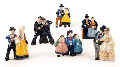 many figurines of people that are standing in a circle