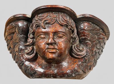 a statue of an angel with wings on it ' s head