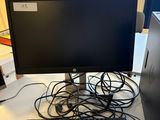 an image of a desk with a computer monitor and keyboard