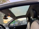 a view of the sunroof from inside of a car