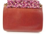 brown leather purse with pink and purple crochet trim