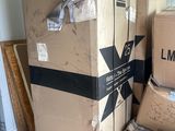 a pile of boxes sitting on the floor in a room