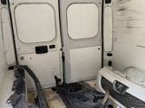a white van that has been vandalized and is in the process of remodeling