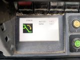 an image of a car dashboard with a green arrow on it