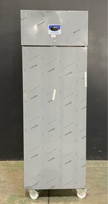an image of a refrigerator that is sitting on wheels