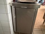 a silver dishwasher sitting in the corner of a kitchen
