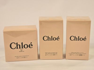 three boxes of chloe perfume sitting next to each other on a table