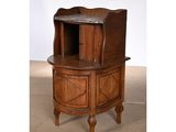 an image of a small wooden cabinet with a shelf
