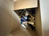 a cardboard box filled with many different types of thread