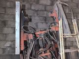 a pile of wires and a ladder in a room