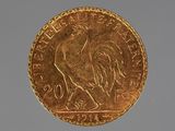 a gold coin with a picture of a rooster on it