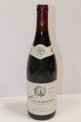 a bottle of wine that is sitting on a table