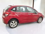 a red car that is parked in a garage