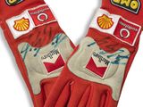 pair of red gloves with shell logos on them on a white background