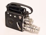 a small camera that is sitting on a white surface