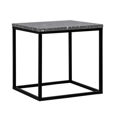 une table d'appoint en marbre noir et blanc avec une structure en métal noir