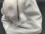 an image of a white purse with a zipper on it