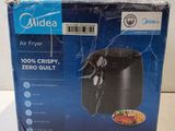 an image of a box of air fryer sitting on top of a counter