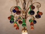 a multicolored glass chandelier hanging from a ceiling