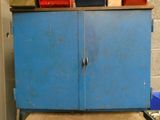a blue cabinet that is sitting in a room