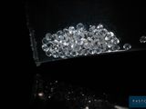 a bag full of clear crystals sitting on a table