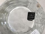 a glass bowl with a label on it sitting on a table