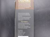 the back of a box with a label on it on a black surface