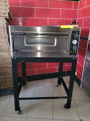 an image of a commercial pizza oven in a kitchen