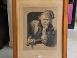 une vieille photo d'un vieil homme tenant un couteau à la main