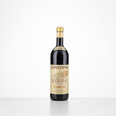 a bottle of wine sitting on top of a white table