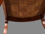 an image of a wooden rocking chair with a seat made out of wood