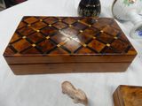 a wooden box with a checkerboard pattern on it