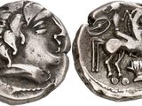 a close up of a coin with a horse on it