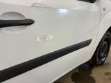 a white car with a black stripe on the side of it