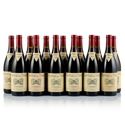 six bottles of wine lined up in a row on a white surface